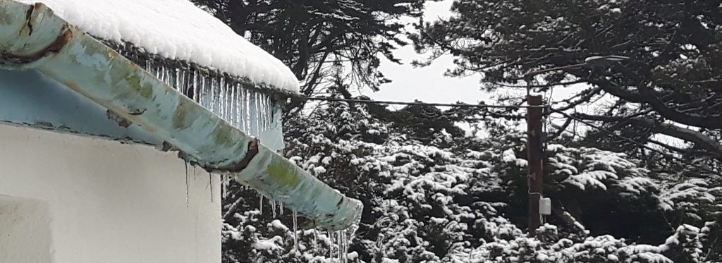 Damaged guttering in winter