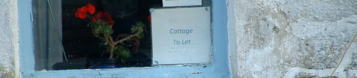 Rental cottage to let sign displayed in house window