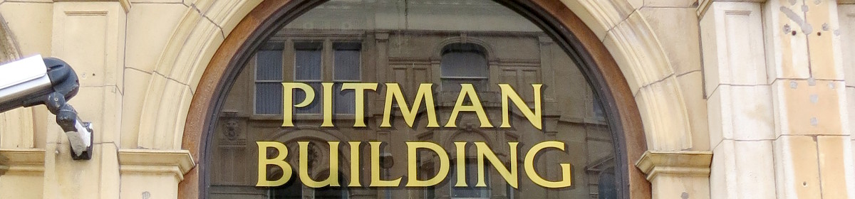 Pitman Building with buildings reflected