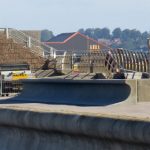 photo of flood defence work being carried out in 2014 overlook Chesil Beach on the doorstep of the Cove House Inn public house at Portland, Dorset