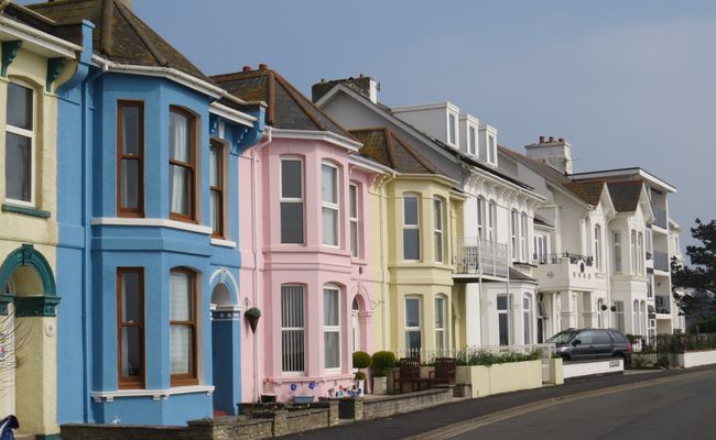 A row of colourful terraced properties in Exmouth