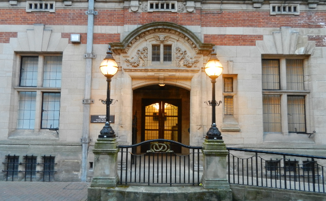 Stafford period building with lamps.